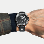 Breckmont Meridian silver men's dress watch on wrist black dial black leather strap